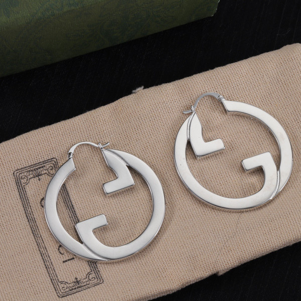 G*u*i earrings